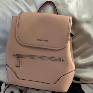 Not even a couple months old it’s a light pink bookbag/pocketbook